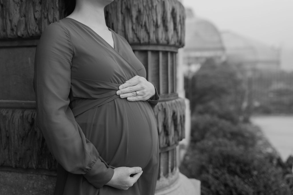 black and white photos of woman's pregnant belly