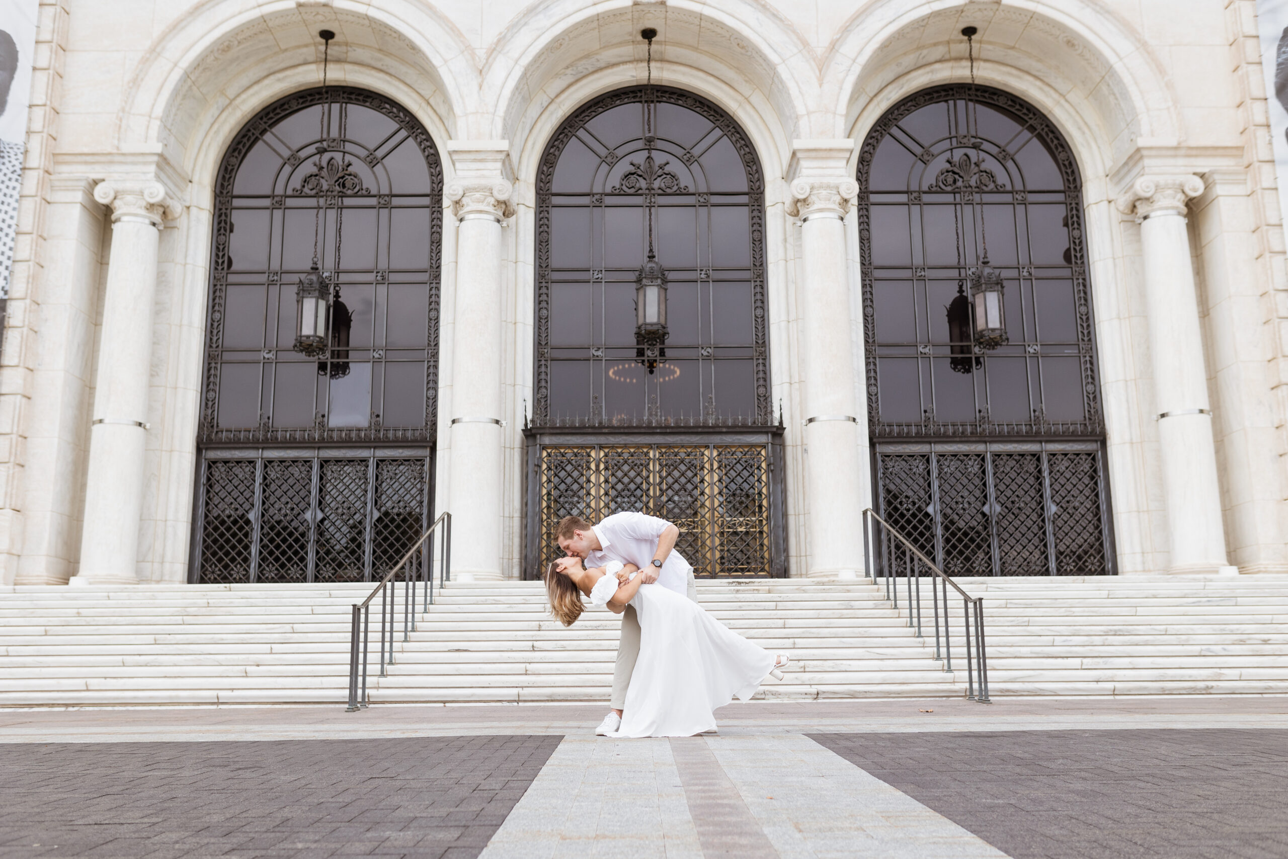 Man and woman kissing during engagement photography in Detroit Michigan