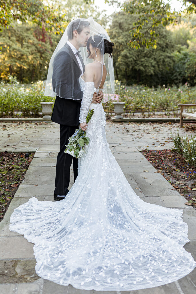 Groom and bride in gardens at The Ford House by Wedding Photographer Savvy Shoots Photography