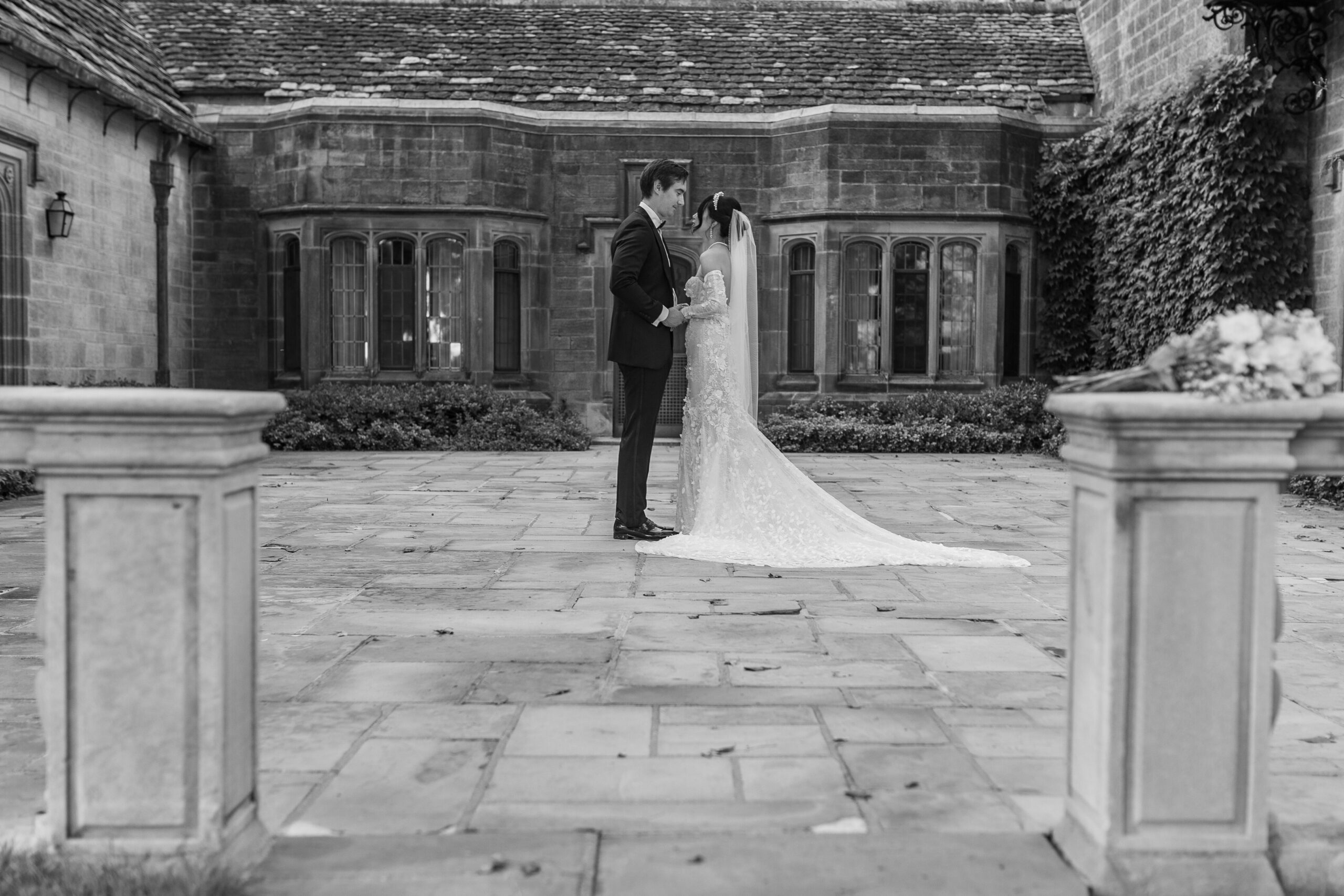 Groom and bride standing together at The Ford House by Wedding Photographer Savvy Shoots Photography