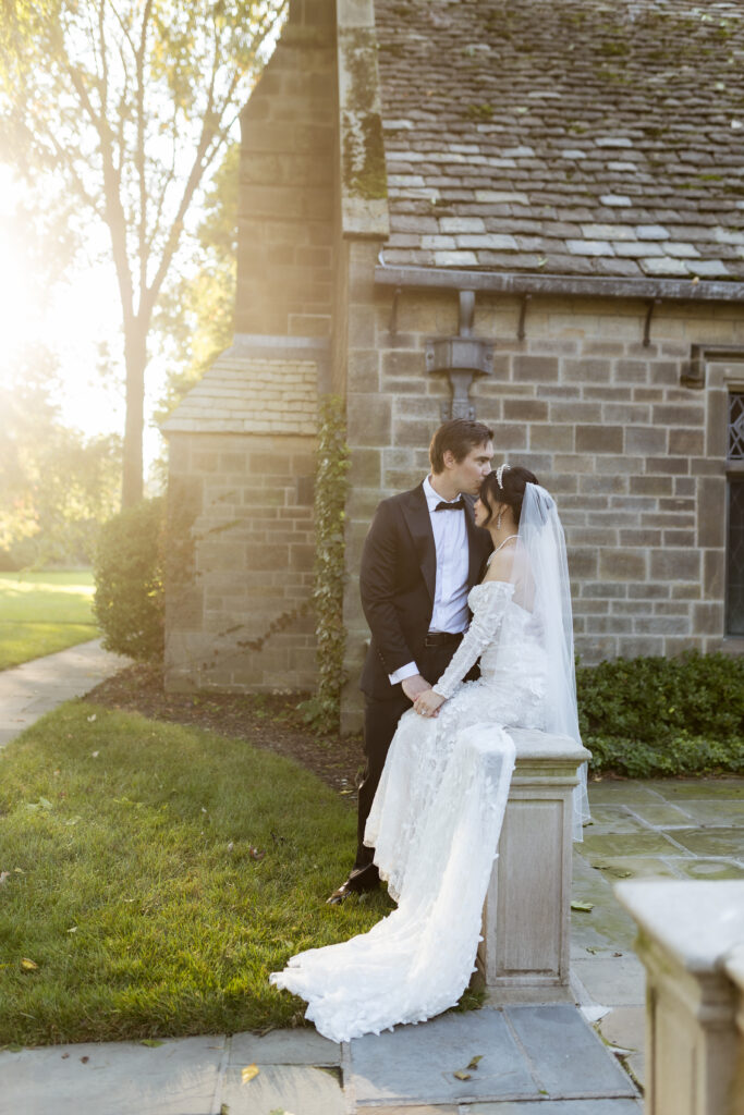 Groom kissing bride at The Ford House by Wedding Photographer Savvy Shoots Photography