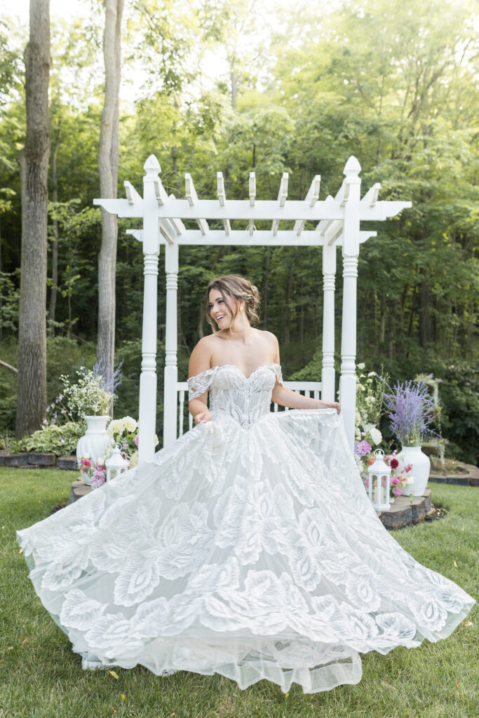 Bride outside in white wedding dress by Wedding Photographer Savvy Shoots Photography