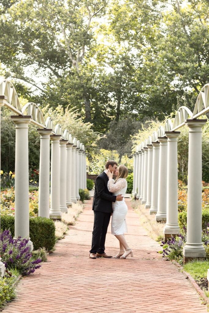 Man and woman kissing during engagement photos in Rochester Hills Michigan