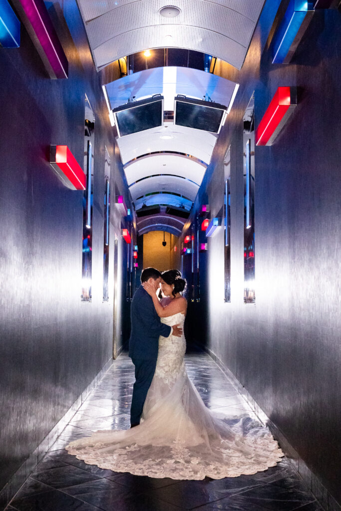 Bride and groom posing for Detroit wedding photography at MotorCity wedding venue