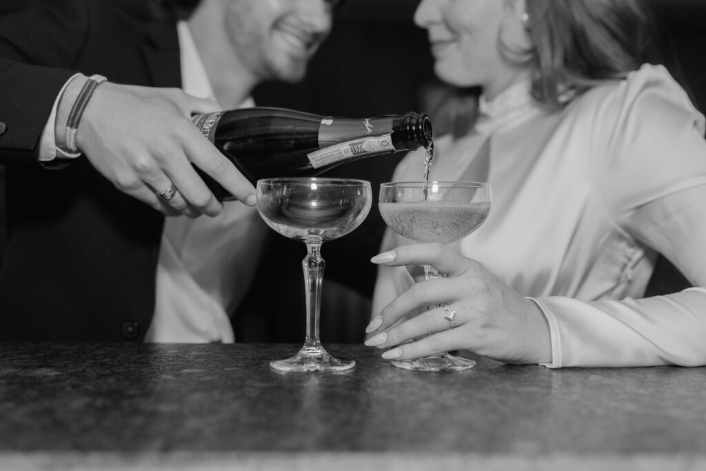 Man pouring during at bar during Detroit engagement photography