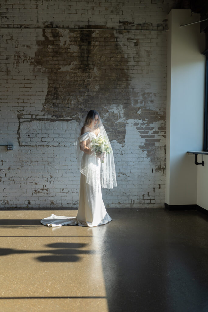 Bride standing for Oxford Michigan wedding Photographer Savvy Shoots photography.