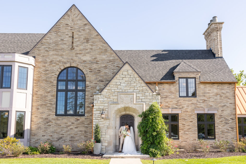 Bride and groom taking wedding photos during Grand Rapids wedding photography at Venue3Two