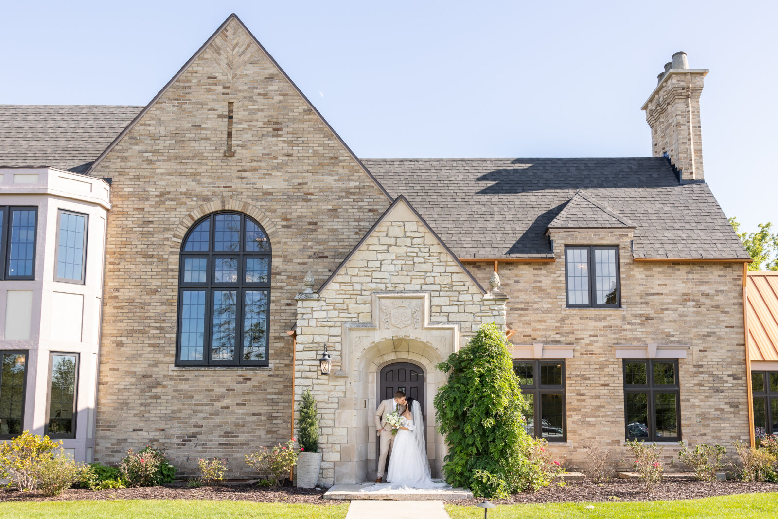 Bride and groom posing for Grand Rapids wedding photography at Venue3Two