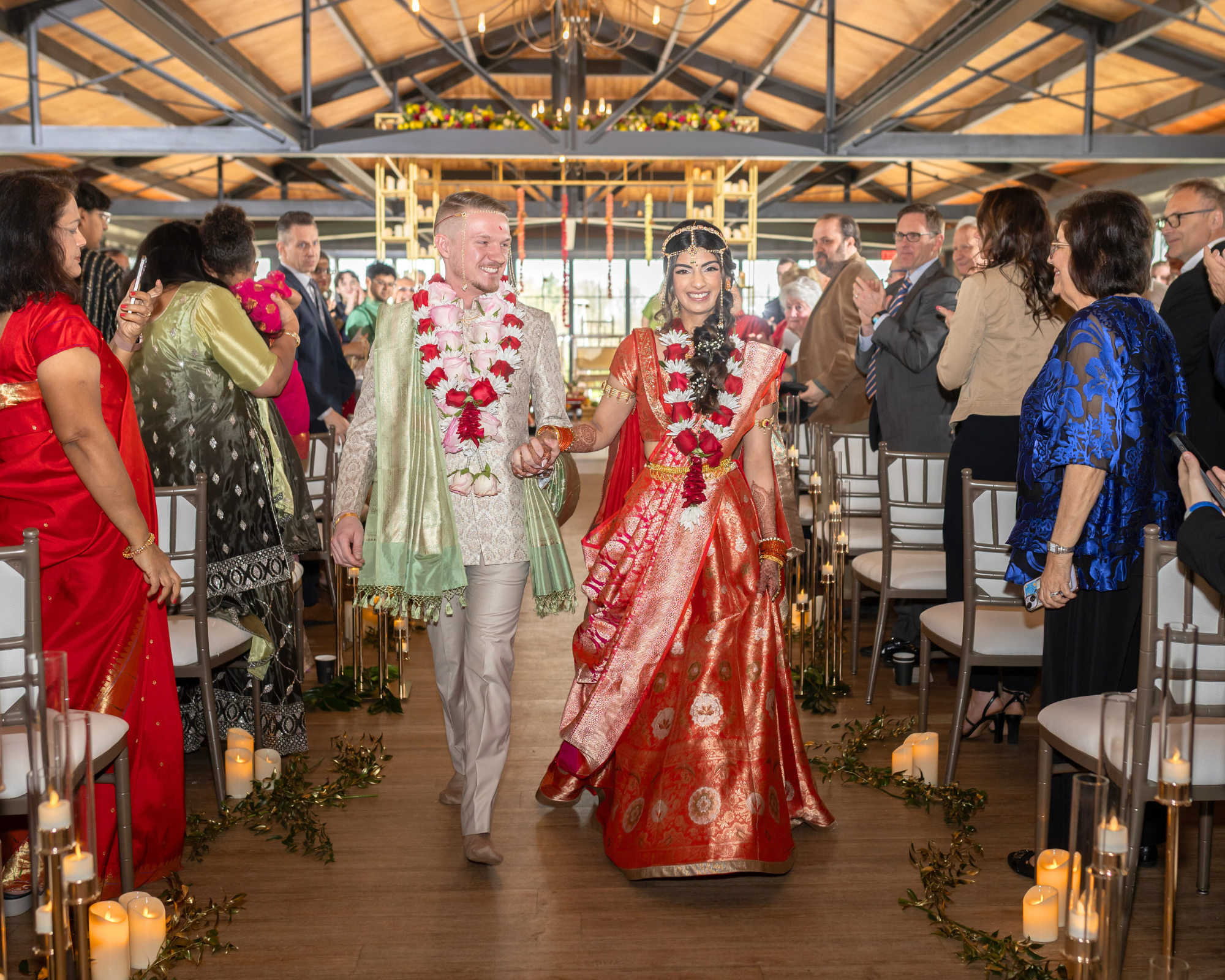 Bride and groom walk down the aisle after wedding ceremony at Saint John's Resort in Plymouth, MI