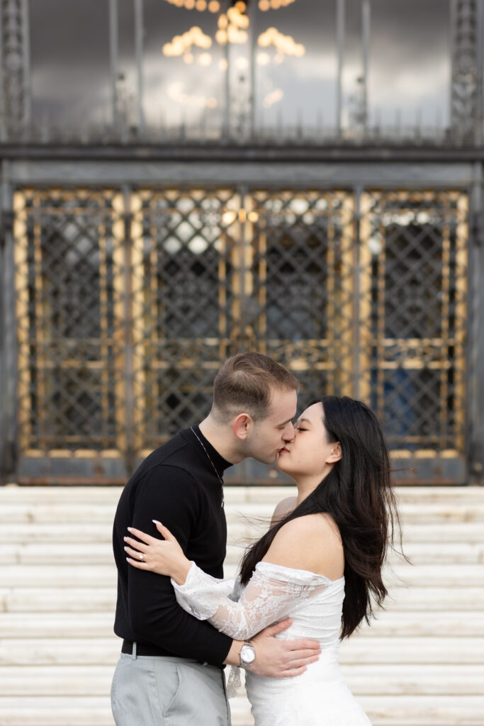 Man and woman kissing during Detroit engagement photography