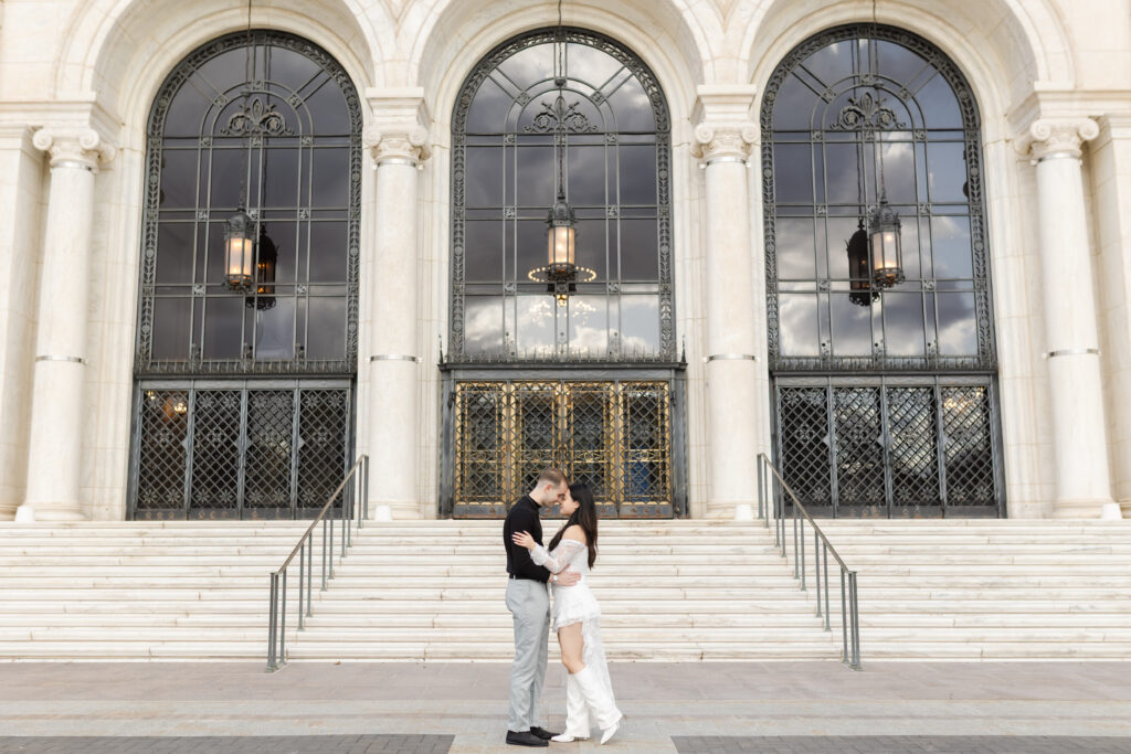 Man and woman looking at each other during Detroit engagement photos