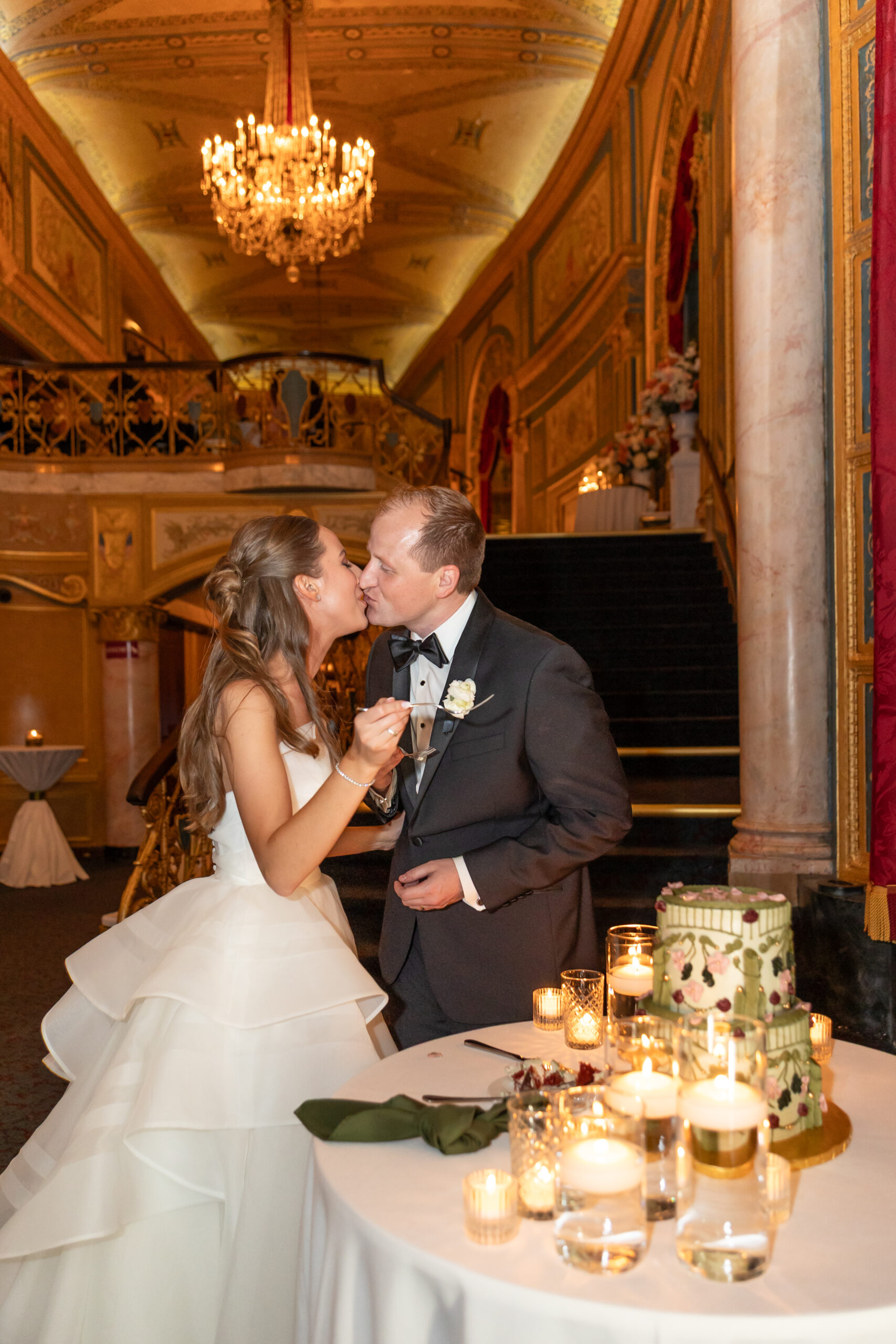 Bride and groom cut cake on wedding at Detroit Opera House