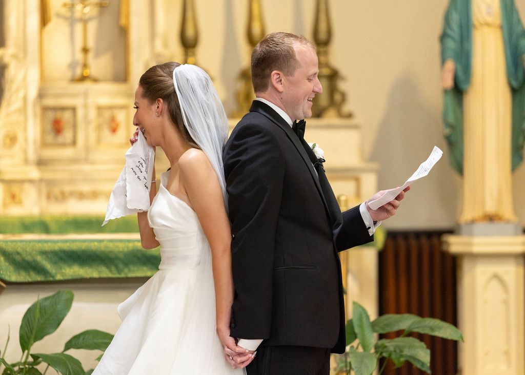 Bride tears up during first touch during Downtown Detroit Wedding