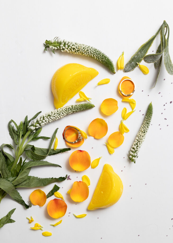 wedding rings styled with flowers for wedding detail photos by Metro Detroit Wedding Photographer