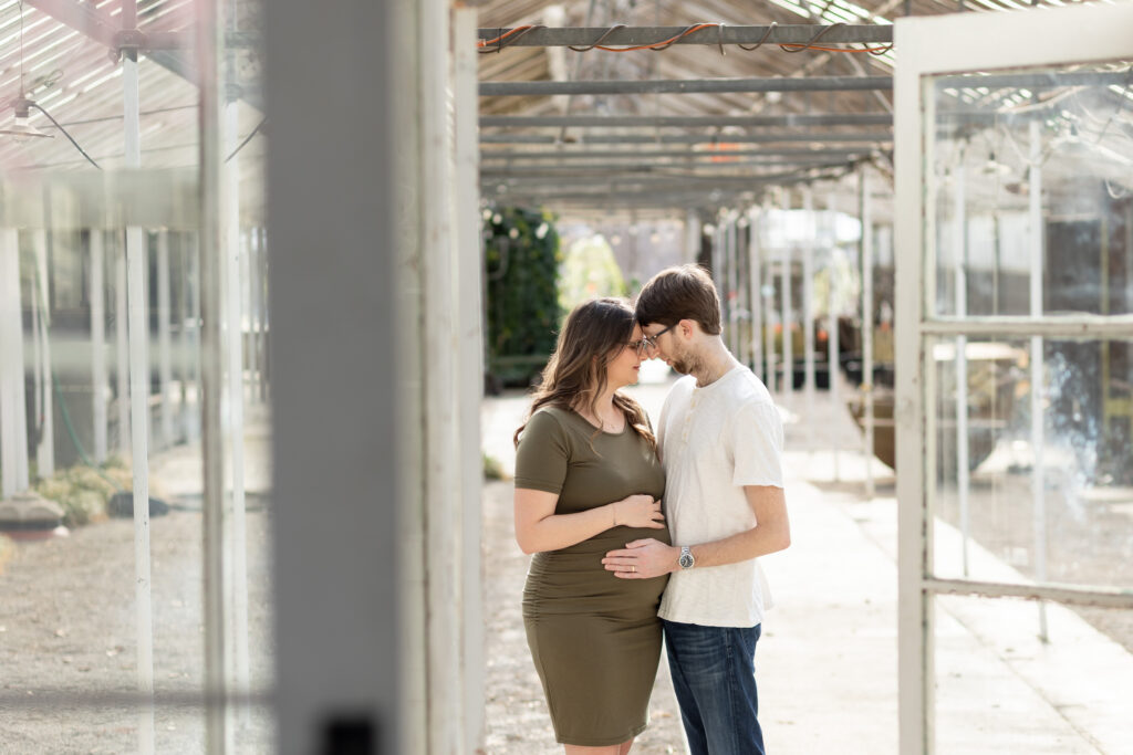 Man and woman taking maternity photos in Oakland County MI