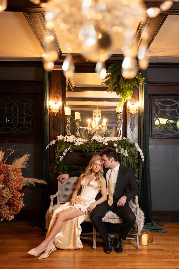 Man and woman posing for engagement photos in Metro Detroit
