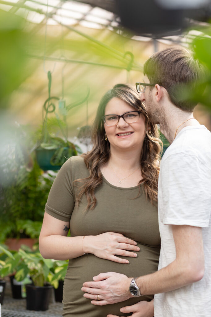 Man and woman taking maternity photos in Oakland County MI by Savvy Shoots
