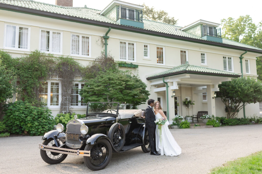 Groom looks at bride during west Michigan wedding photography in Suagutuck