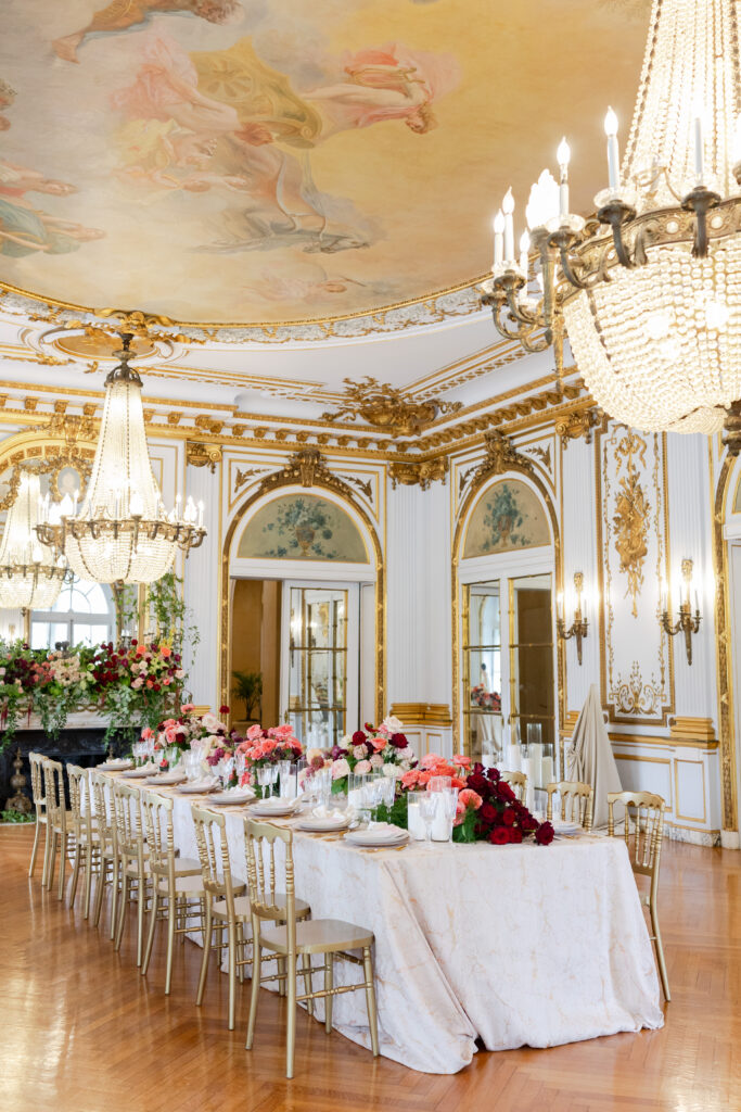 Table set up for wedding reception with white tablecloth inside Elkins Estate Wedding Venue